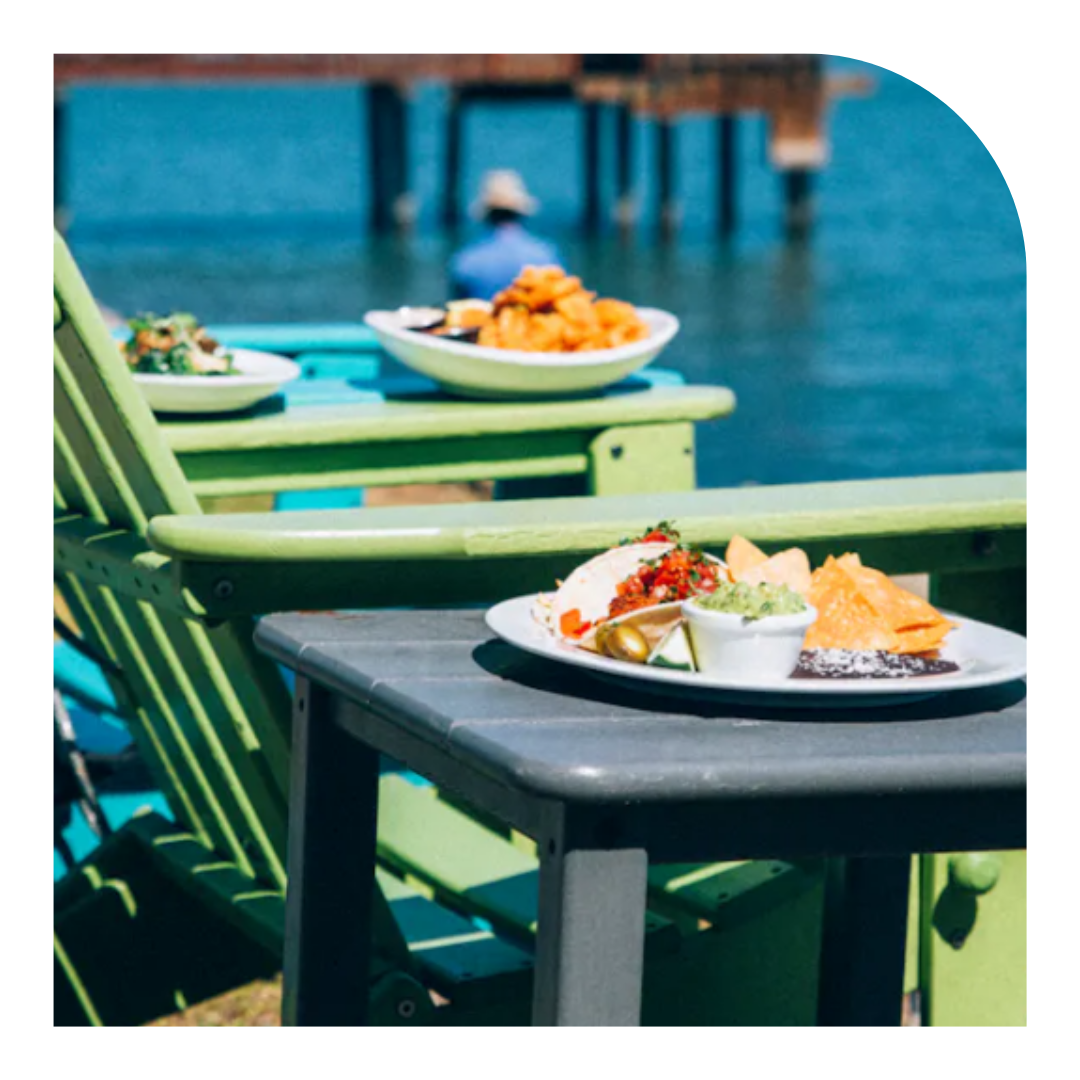 photo of a plate of food with Adirondack chairs in the background