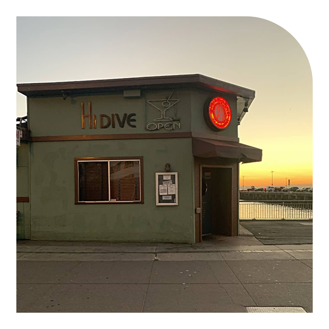 Photo of the a dive bar at sunset by the waterfront