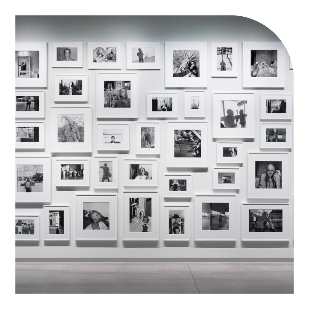 photo of a wall of B&W photos in a gallery