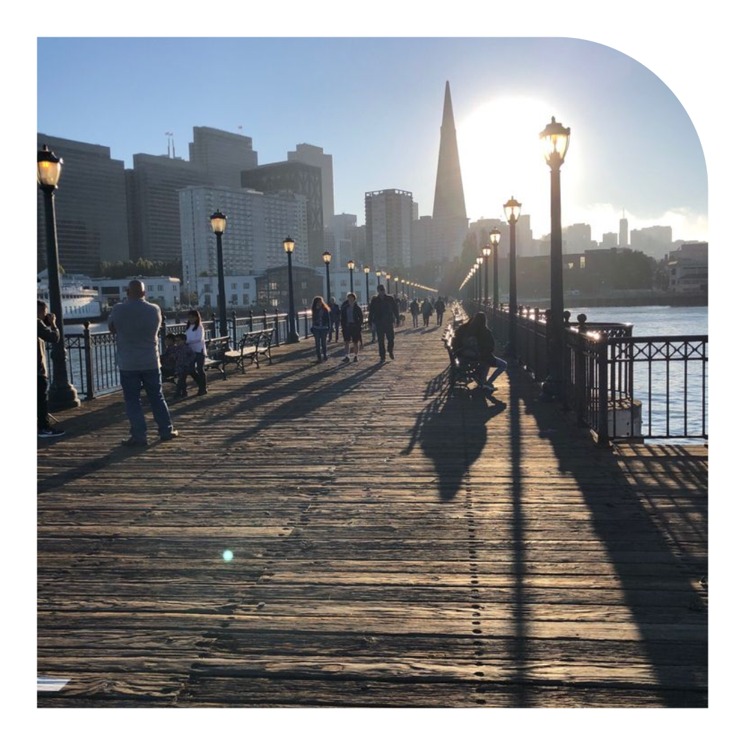 photo of a wooden pier with the Transamerica building in the background
