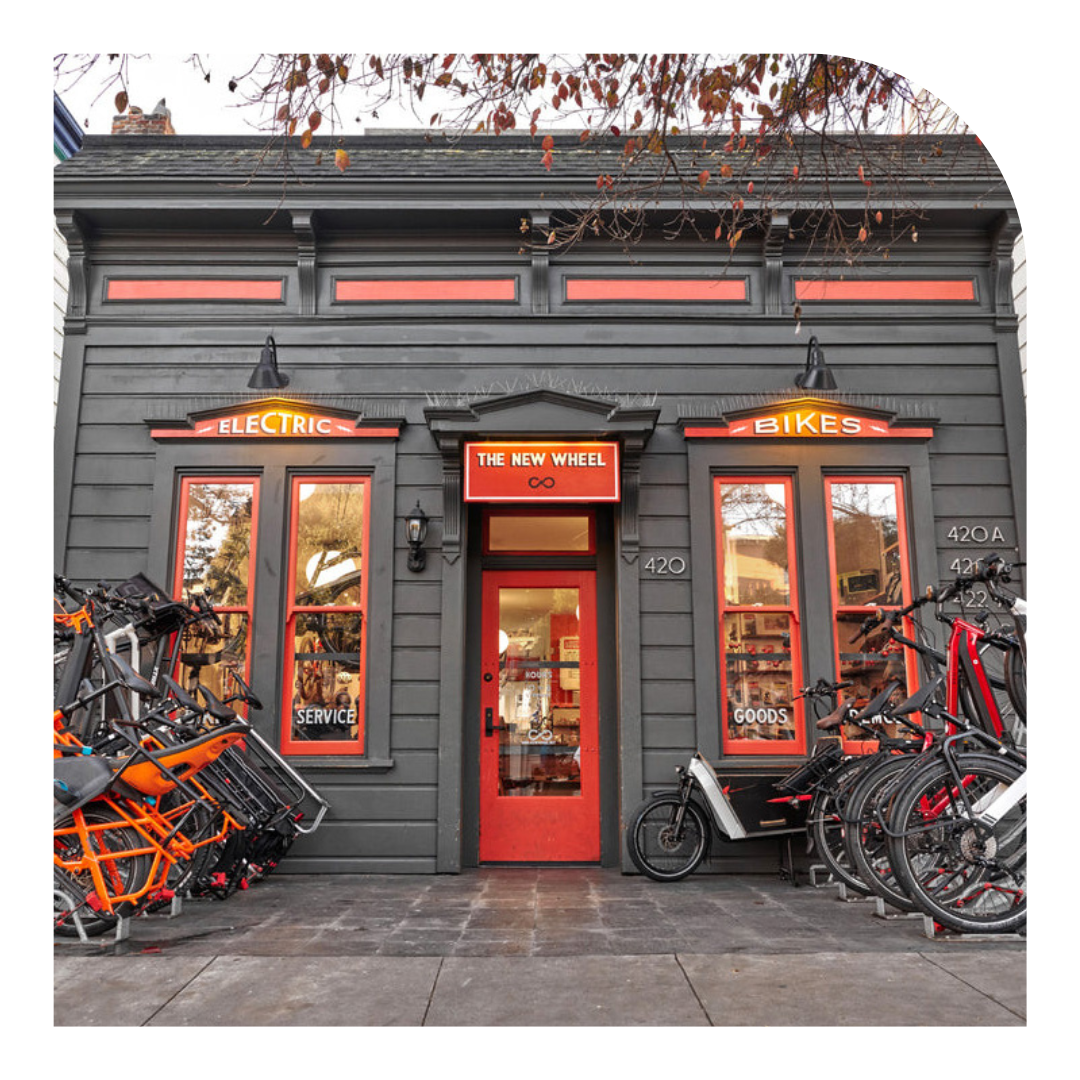 photo of the storefront of a bicycle shop with bikes outside