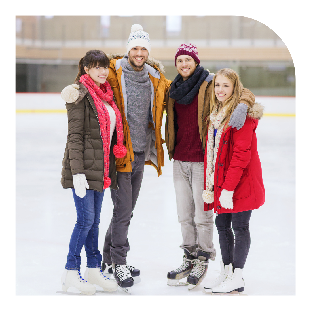 photo of a quartet smiling in ice skates