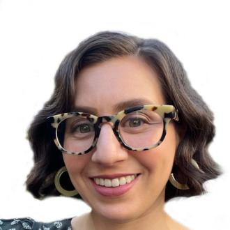 Woman with short brown hair, wearing a floral patterned top, leopard print glasses, and stone hoop earrings.